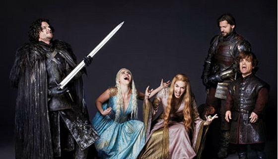 Cast members from Game of Thrones break character to play air-guitar at a photoshoot