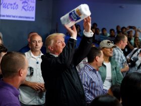 Donald Trump throwing a roll of paper towels to a crowd waiting for disaster supplies in Puerto Rico