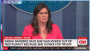 Screenshot from CNN coverage of Sarah Sanders delivering a press briefing, with chyron reading "Sarah Sanders says she was kicked out of restaurant because she works for Trump"
