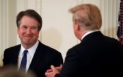 Supreme Court nominee Brett Kavanaugh smiles at Donald Trump at the press conference announcing his nomination.